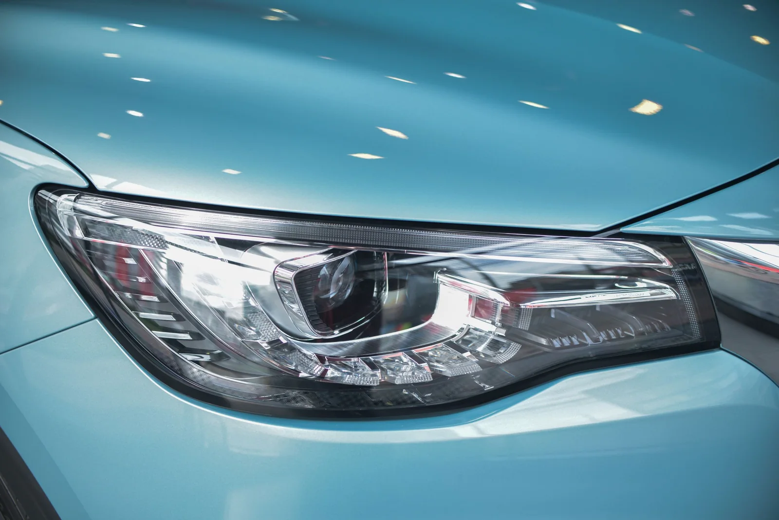 A clear, clean car headlight up close